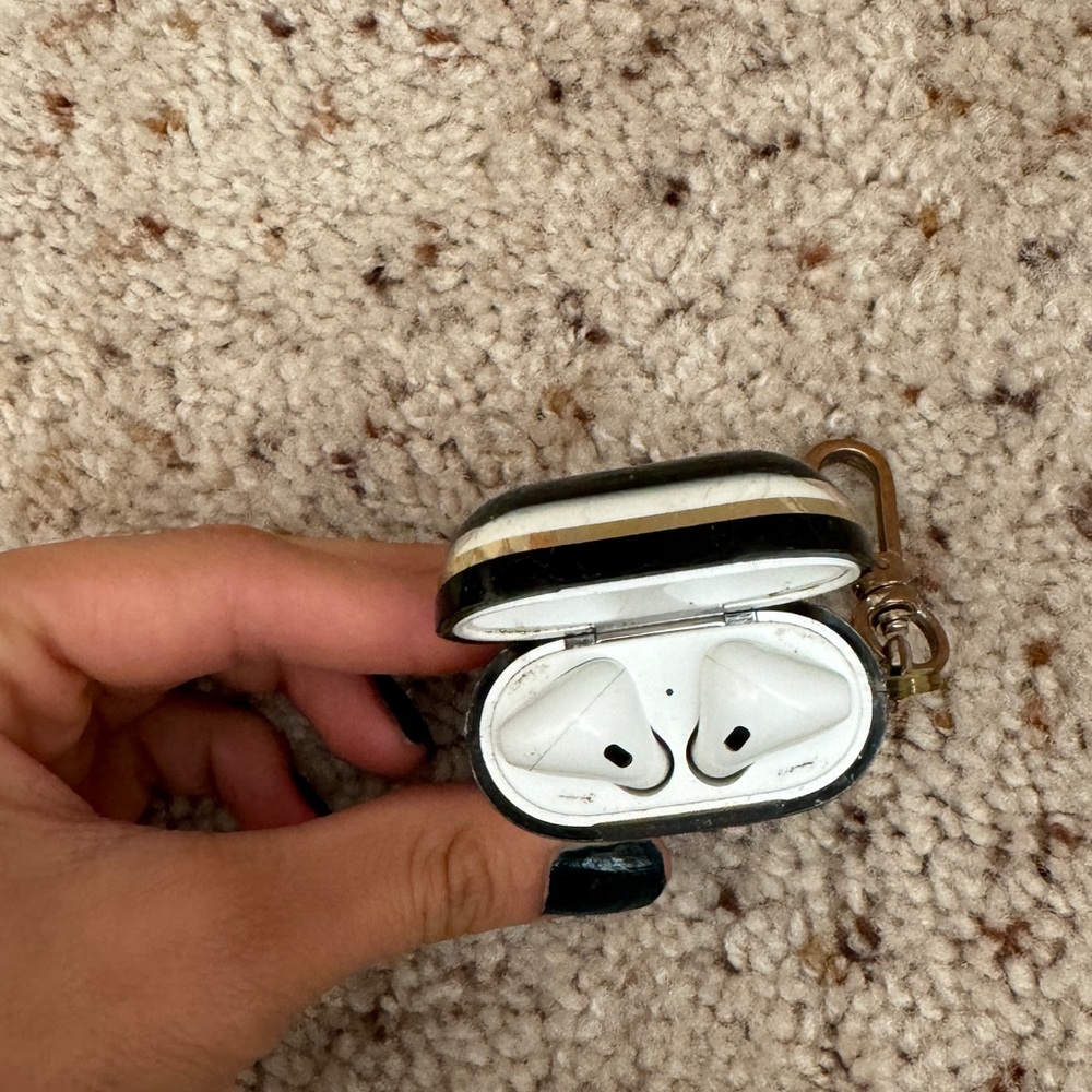 Apple AirPods (2nd generation) with a Kate spade case